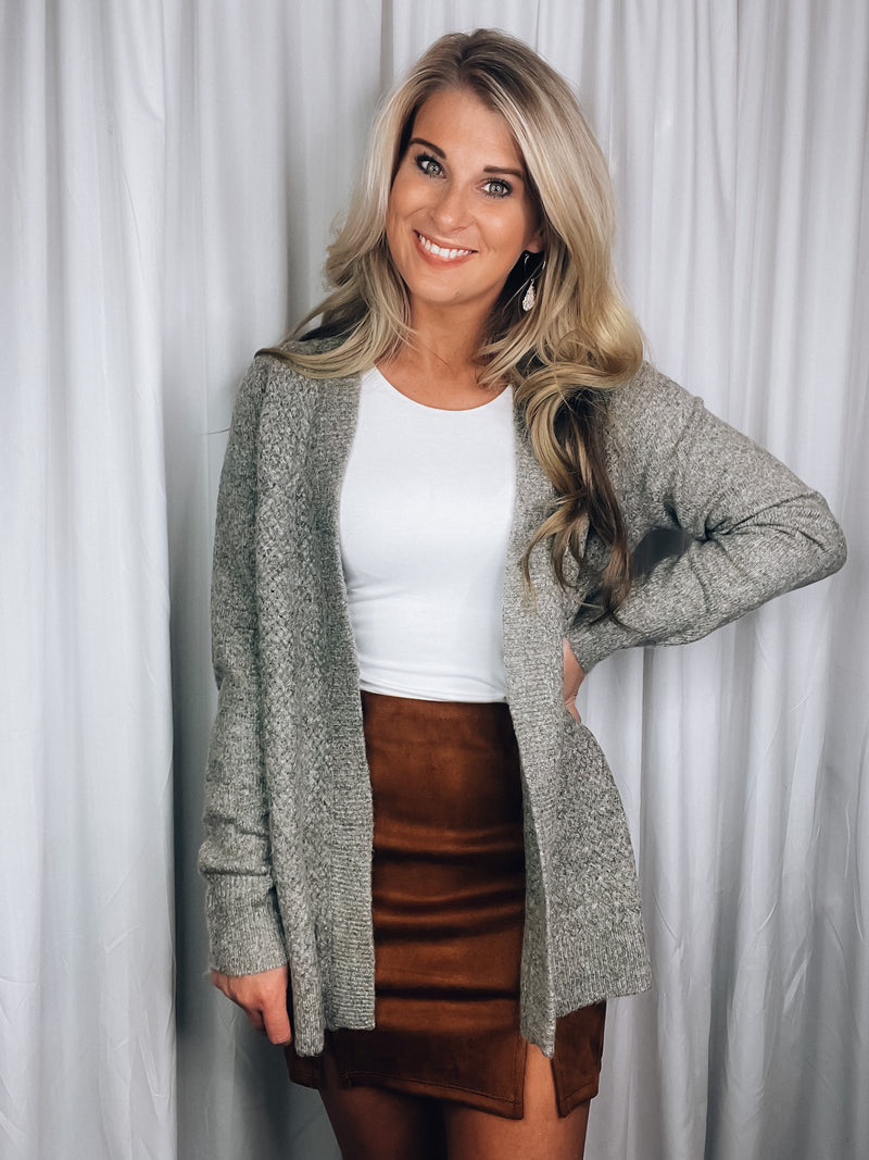 Cardigan features a heather olive tone, long sleeves, open front, super soft material and runs true to size! 