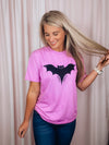 Graphic features a solid base colored tee, short sleeves, unisex fit, distressed black design and runs true to size!-pink