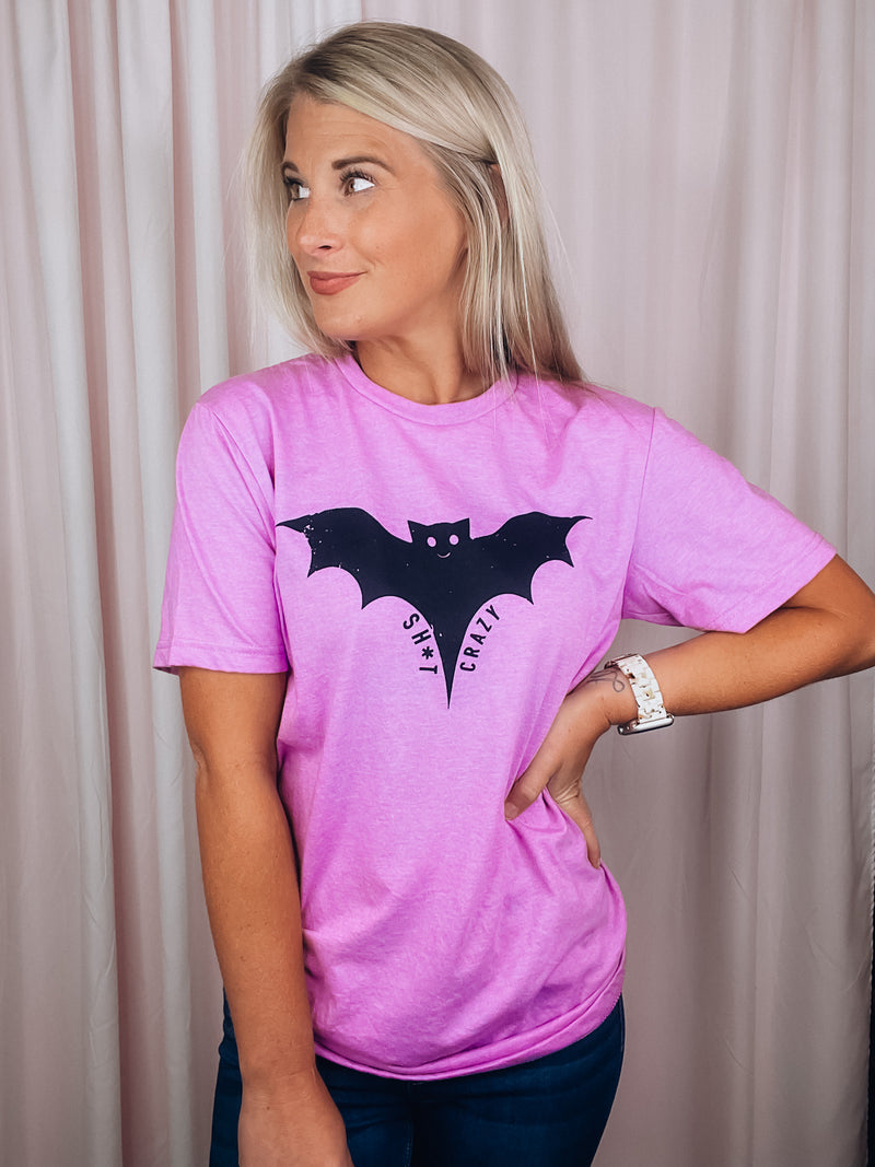 Graphic features a solid base colored tee, short sleeves, unisex fit, distressed black design and runs true to size!-pink