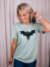 Graphic features a solid base colored tee, short sleeves, unisex fit, distressed black design and runs true to size!-sage