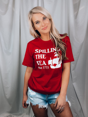 Graphic features a solid base color, short sleeves, unisex fit, round neck line and runs true to size!-red