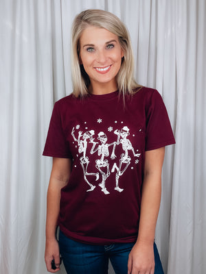 Graphic features a solid base color, short sleeves, dancing skeleton design unisex fit and runs true to size! -maroon