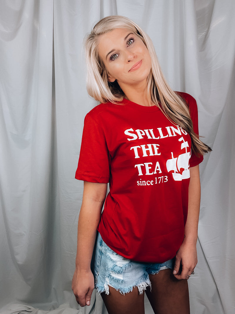 Graphic features a solid base color, short sleeves, unisex fit, round neck line and runs true to size!-red