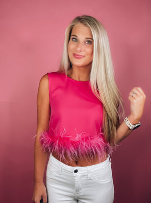 Tank features a black round neck design with black feather trim. If in-between sizes, we suggest sizing up-pink