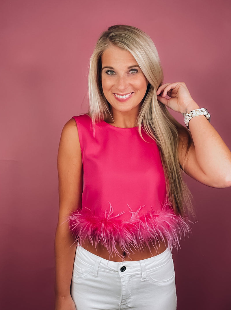 Tank features a black round neck design with black feather trim. If in-between sizes, we suggest sizing up-pink