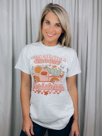 Graphic features an ash grey tee, short sleeves, groovy Christmas design and runs true to size! 