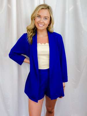 Blazer features a solid base color, open front, long sleeves and runs true to size!   Materials:  100% Polyester-royal