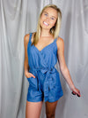 Romper features a denim color, soft material, sleeveless detail, tie belt, pockets, adjustable straps, snap button closure and runs true to size! 