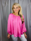 Top features a solid base color, long sleeves, thin material, on/off the shoulder detail, elastic neck/ shoulder detail and runs true to size!-hot pink