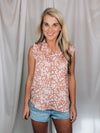 Top features a solid base color, floral print detail, sleeveless ruffle top, ruffle neck line and runs true to size!-mauve