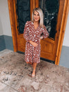 Dress features a brown/ cream abstract print, 3/4 sleeves, faux wrap detailing, stretchy material and runs true to size! 