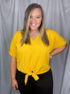 Top features a solid base color, V-neck line, cuffed short sleeves, front waist tie detail, loose fit and runs true to size!-mustard