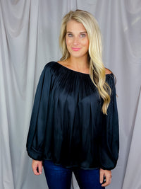 Top features a solid base color, long sleeves, thin material, on/off the shoulder detail, elastic neck/ shoulder detail and runs true to size!-black