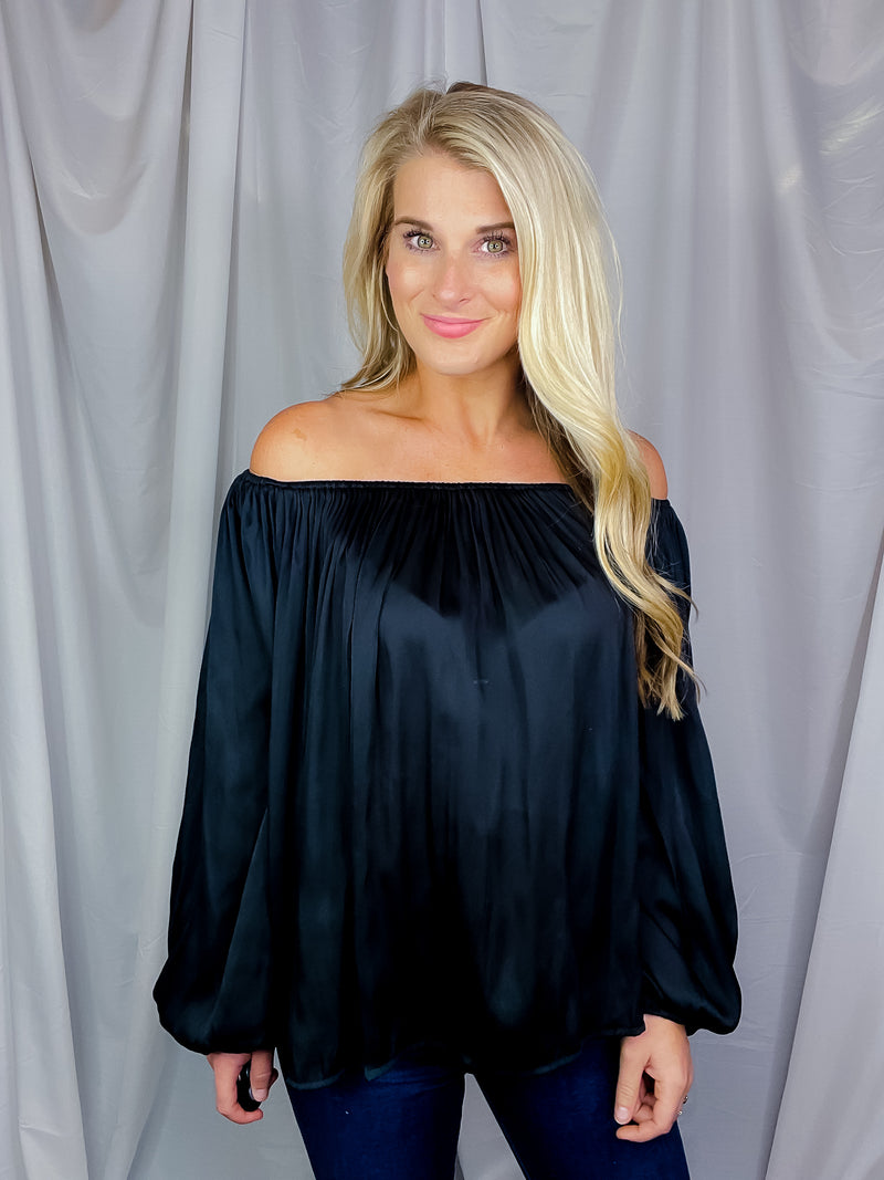 Top features a solid base color, long sleeves, thin material, on/off the shoulder detail, elastic neck/ shoulder detail and runs true to size!-black