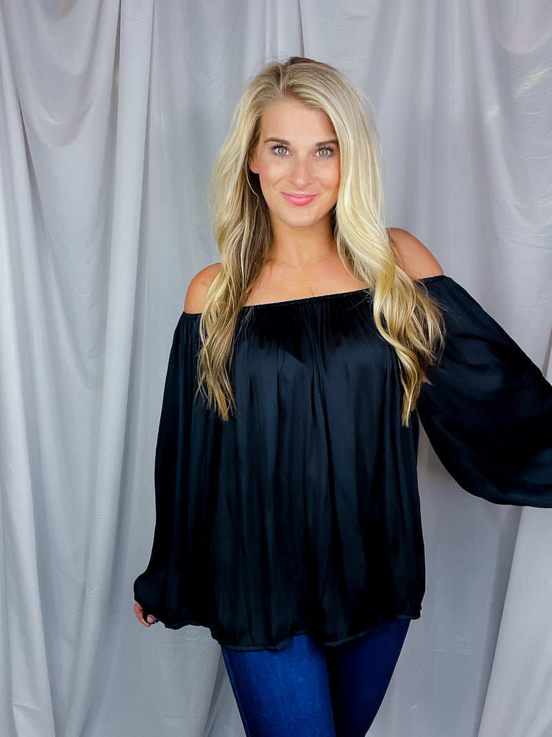 Top features a solid base color, long sleeves, thin material, on/off the shoulder detail, elastic neck/ shoulder detail and runs true to size!-black