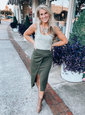 Skirt features a pencil fit, dreamy olive color, asymmetrical drape detailing, and runs true to size! 