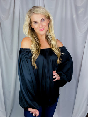 Top features a solid base color, long sleeves, thin material, on/off the shoulder detail, elastic neck/ shoulder detail and runs true to size!-black