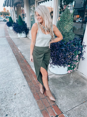 Skirt features a pencil fit, dreamy olive color, asymmetrical drape detailing, and runs true to size! 