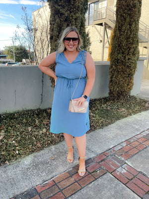 Dress features a beautiful dusty blue color, V-neck line, sleeveless detail,  shoulder ruching detail, elastic tie waist band and runs true to size! 