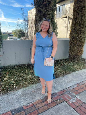 Dress features a beautiful dusty blue color, V-neck line, sleeveless detail,  shoulder ruching detail, elastic tie waist band and runs true to size! 