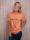 Graphic features a solid base colored tee, short sleeves, black design, unisex fit and runs true to size! -peach