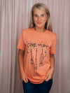 Graphic features a solid base colored tee, short sleeves, black design, unisex fit and runs true to size! -peach