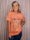 Graphic features a solid base colored tee, short sleeves, black design, unisex fit and runs true to size!-peach