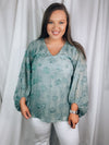 Top features a light sage base, 3/4 sleeve, lined underneath, V-neck line, elastic at the bottom of the sleeves, distressed detailing, relaxed fit and runs a little oversized.  *Aubree wore a MEDIUM and normally wears a LARGE.   *If you are big chested we recommend sticking with your normal size! 