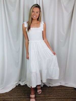 Dress offers adjustable tie straps, smocked chest detail, underlining, midi length and runs true to size. 