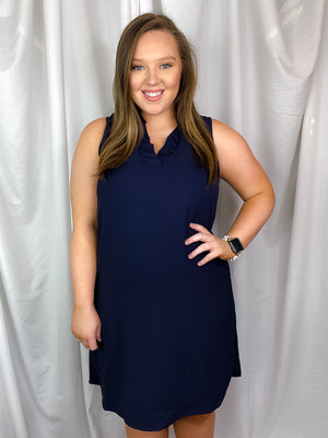 This dress features a sleeveless design with a perfect addition of ruffle V-neck detailing, leaving you feeling fun and professional all at the same time!-navy