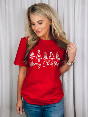 Graphic features a solid base color, short sleeves, white Merry Christmas with trees design, unisex fit and runs true to size!-red