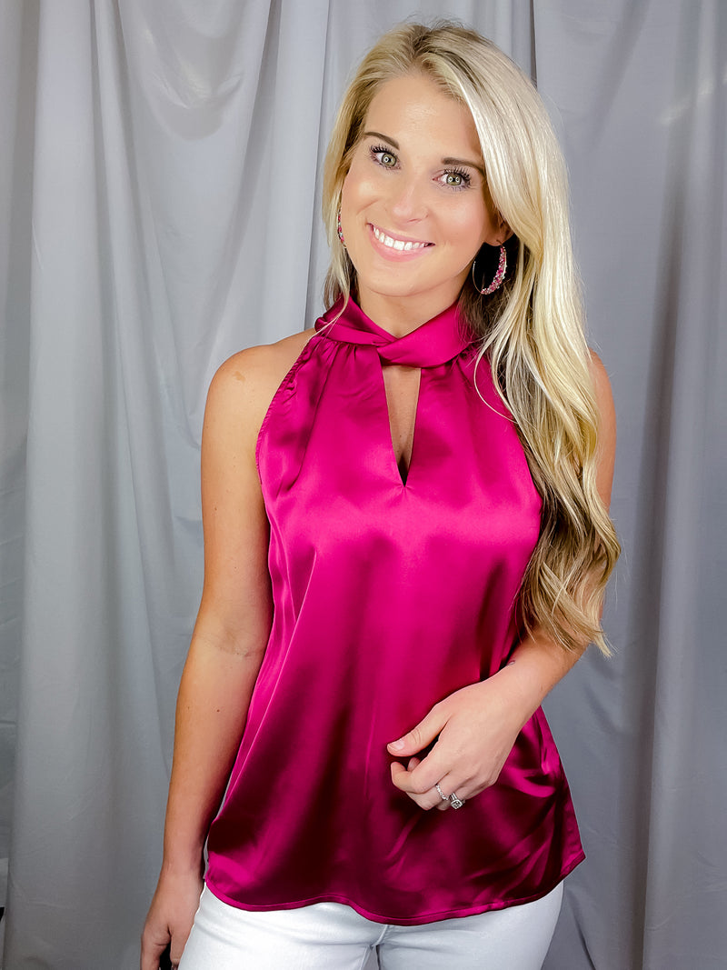 Top features a stunning magenta color, front cut out to add that spunk, sleeveless detail adding comfort and runs true to size! 