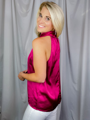Top features a stunning magenta color, front cut out to add that spunk, sleeveless detail adding comfort and runs true to size! 