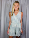 Romper features a cream-teal color, faux wrap detail to add nice detailing, functional pockets, V-neck line, sleeveless detail and runs true to size! 