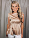 Top features a solid color, amazing silk material, sleeveless detail, baby doll fit, and runs true to size!-taupe