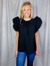 Top features a solid color allowing easy pairing, short ruffle sleeves to add detailing, round neck line, comfortable everyday fit and runs true to size! -black