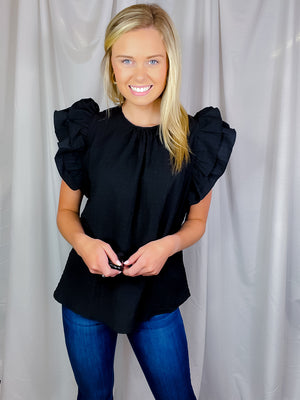 Top features a solid color allowing easy pairing, short ruffle sleeves to add detailing, round neck line, comfortable everyday fit and runs true to size!-black