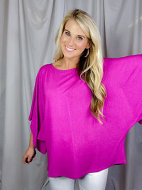 Top features a solid base color, kimono sleeves, round neck line, light weight material and runs true to size! 