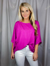 Top features a solid base color, kimono sleeves, round neck line, light weight material and runs true to size! 