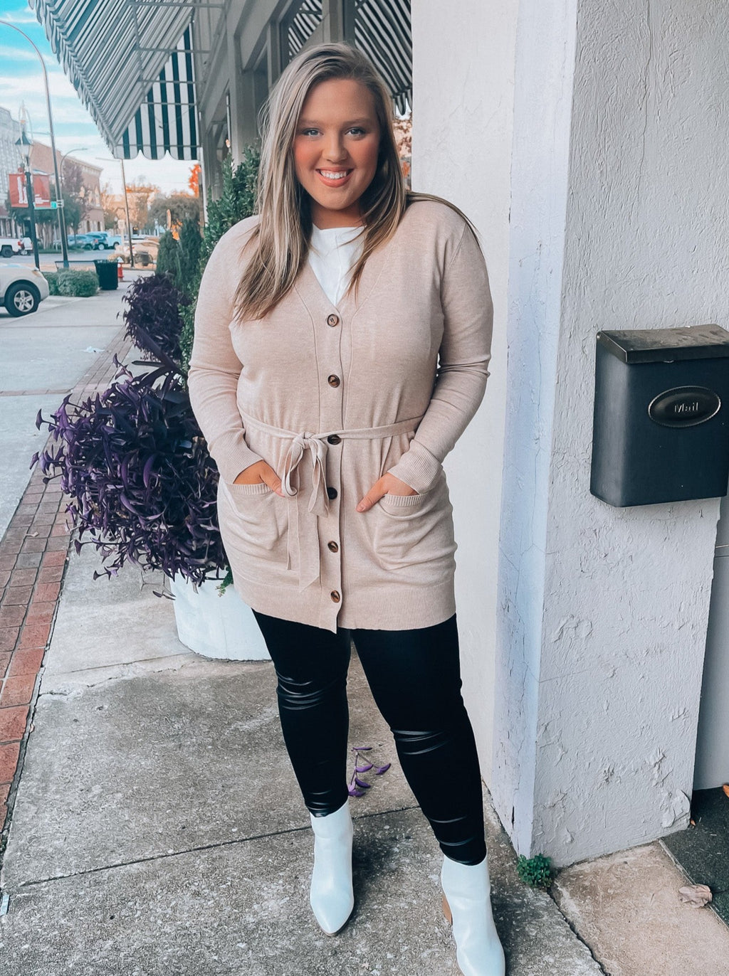 Cardigan features an open front detail, dreamy soft material, long sleeve detail, solid base color, waist tie detail, button down detail, functional pockets and runs true to size! 