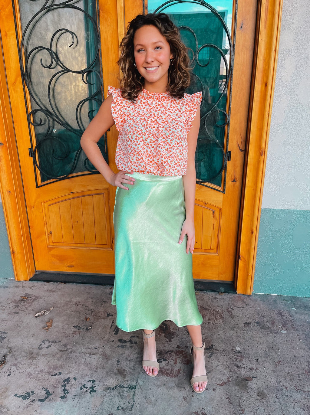 Skirt features a midi length, pastel green coloring, shimmer look, high waist band and runs true to size! 