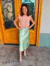 Skirt features a midi length, pastel green coloring, shimmer look, high waist band and runs true to size! 