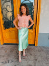 Skirt features a midi length, pastel green coloring, shimmer look, high waist band and runs true to size! 