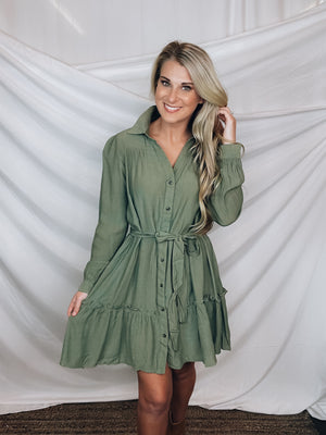 Dress features a solid base color, long sleeves, cuffed wrist, adjustable tie belt, collared detail and runs true to size!-OLIVE
