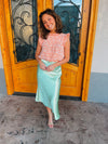 Skirt features a midi length, pastel green coloring, shimmer look, high waist band and runs true to size! 