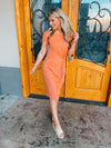 Dress features a sweet peach color, short sleeves, front twist detail, round  neck line, fitted fit and runs true to size! 