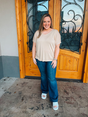 Discover the perfect combination of comfort and style with the Carefree Nights Top. Featuring kimono sleeves, a V-neck line, and a relaxed fit, this top is crafted with lightweight fabric and a neutral taupe color. Enjoy effortless breathability and an unparalleled level of coziness.