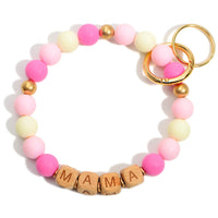 Wooden Beaded Key Ring Featuring Block Letters that Say "Mama".  - Holds Keys - Can Wear on Wrist, Attach to Bags or Purses - Approximately 3.5" in Diameter- PINK