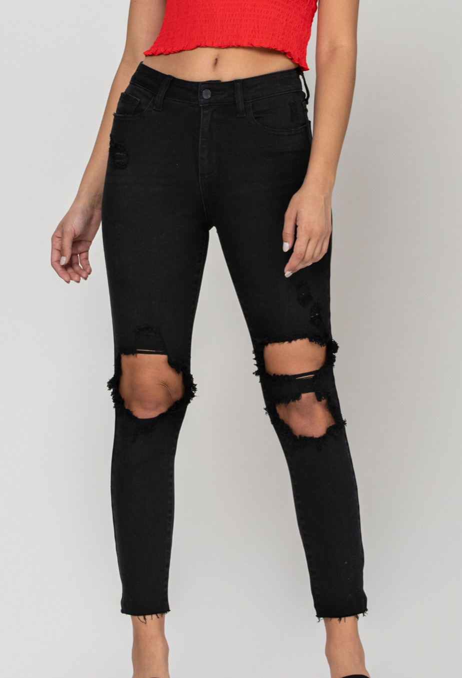 Fitted through the hip and more relaxed through the thigh & knee, our mom skinny jean offers a fit that’s as flattering as it is comfortable. Inspired by the 90s, this jet black wash style with big cutouts along with frayed hem detail gives your look an authentic, vintage vibe.   Inseam: 27"  Rise: 11"