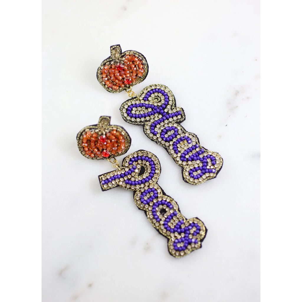 It's just a bunch of Hocus Pocus! This Halloween themed earring has beading and rhinestones with a pumpkin post.  Dimensions: 3.5" long by 1" wide-purple